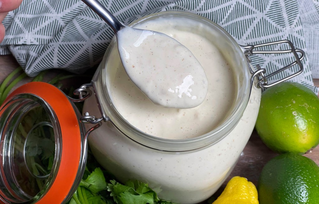 jar of alabama white sauce with spoon in it