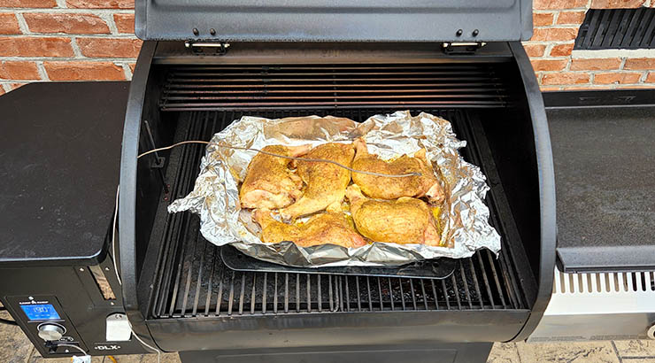 chicken legs smoking on the Camp Chef DLX 24 pellet grill