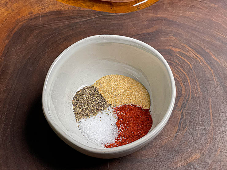 dry rub ingredients in a white bowl
