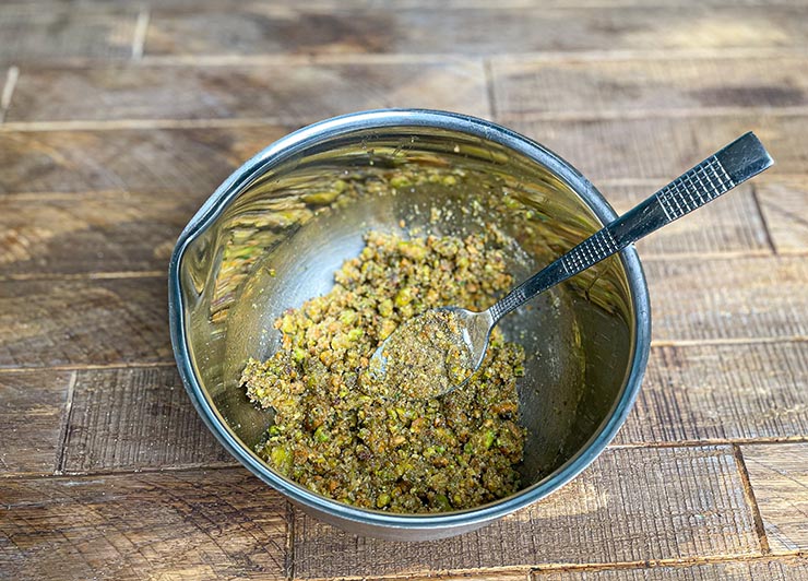 pistachio and bread crumb mix in a metal bowl