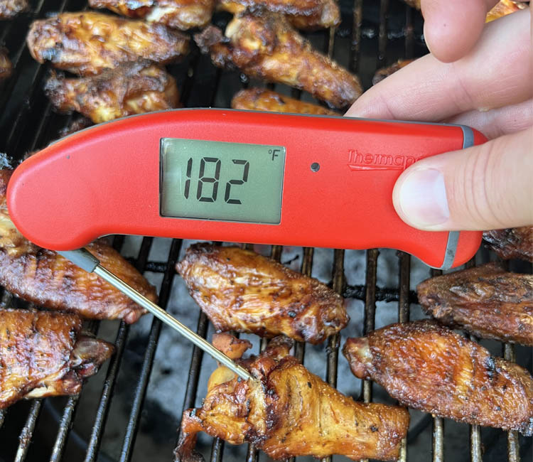 wings on grill with thermapen reading 182 degrees