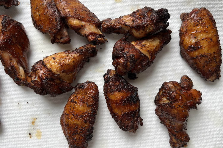 smoked and fried wings on a paper towel