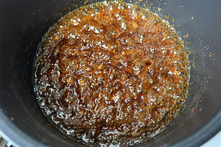 honey garlic sauce bubbling in a pot