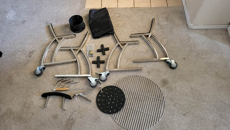 Victory Kamado Grill assembly parts on a carpet floor