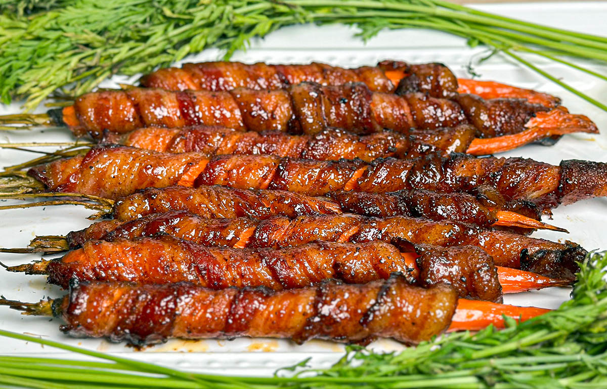 bacon wrapped carrots on serving plate