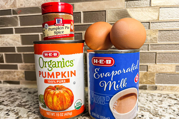 tin of pumpkin, evaporated milk, two eggs and jar of pumpkin spice mix