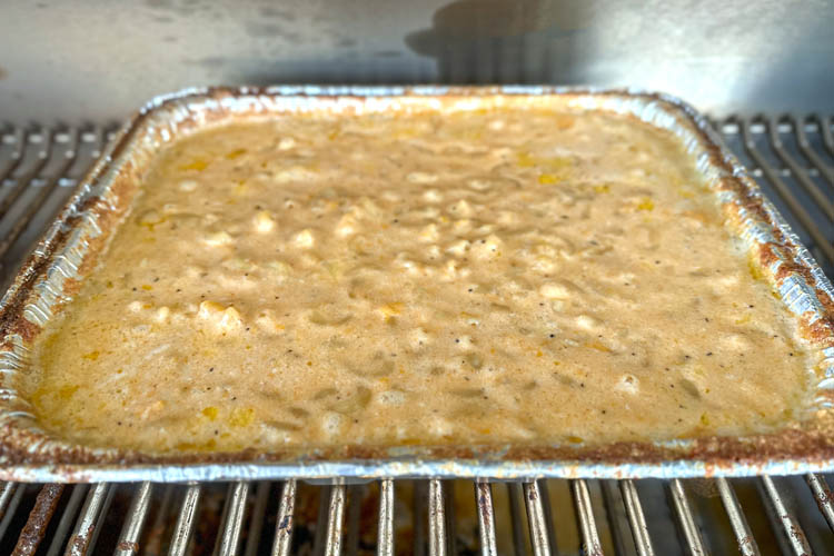 mac and cheese in a foil tray on the grill