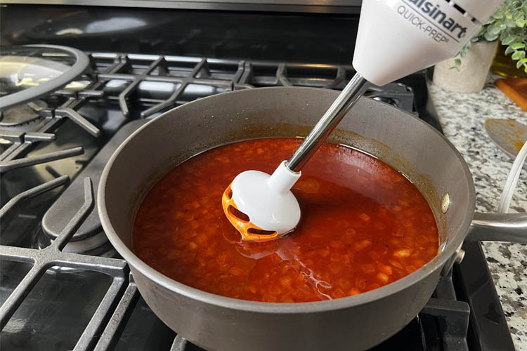 blender being immersed into unblended sauce