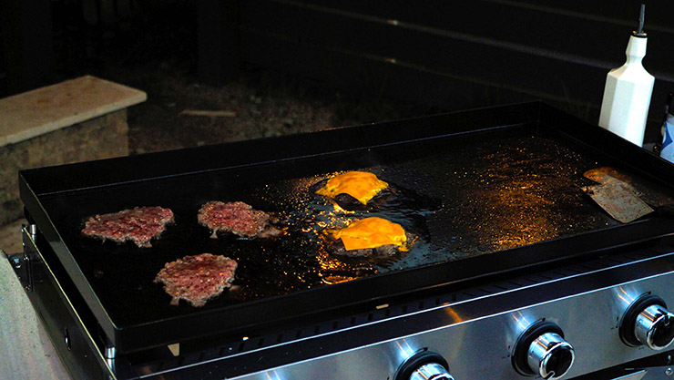 burger patties with melted cheese on the Victory propane gas griddle