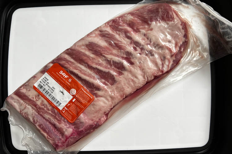 snake river farms ribs in packaging on white plate