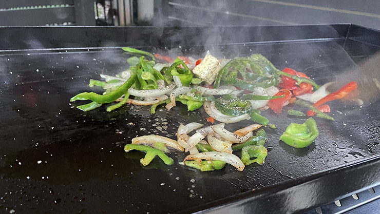 vegetables cooking on the Victory propane gas griddle