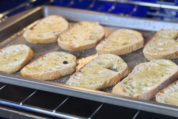 crostini on a silver tray in in the smoker