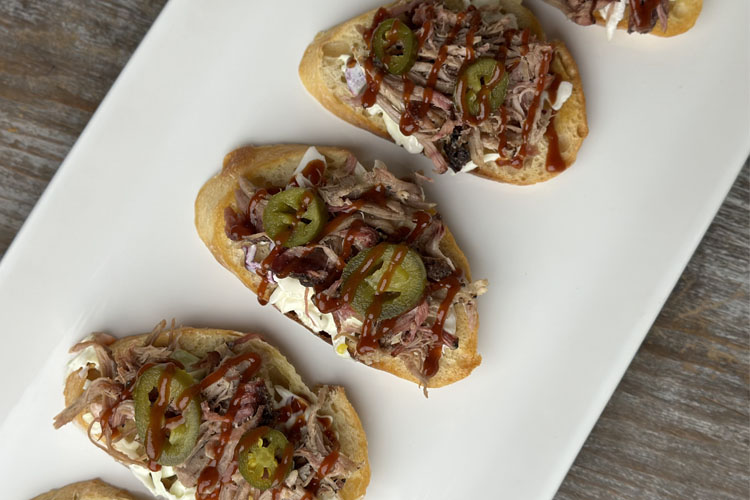 assembled crostini on a white plate