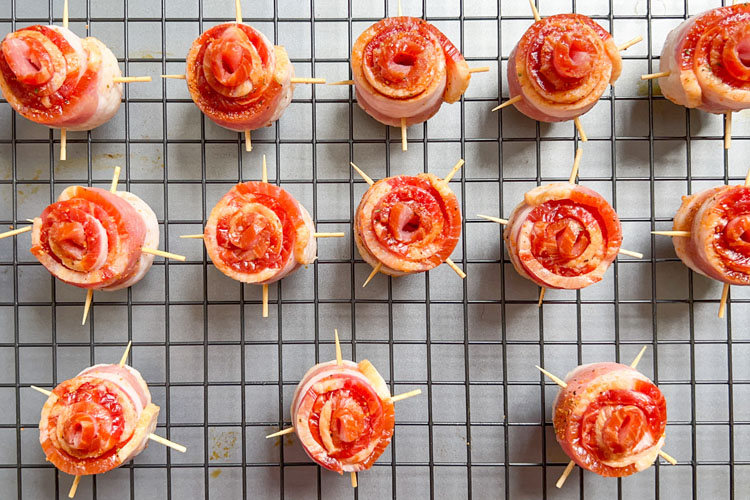 a rack of uncooked bacon roses