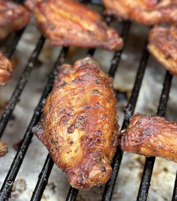 single chicken wing on the grill