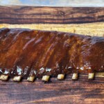 electric smoker ribs on a wood butcher block