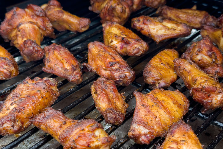 wings cooking on a grill