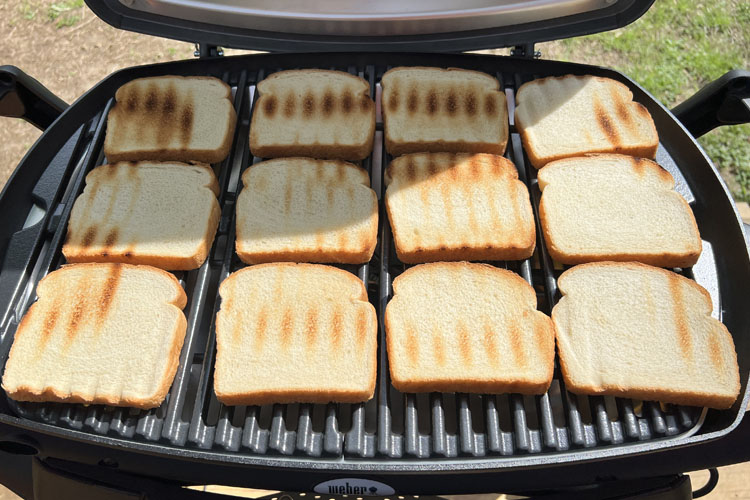 cooked bread laid out on the grill
