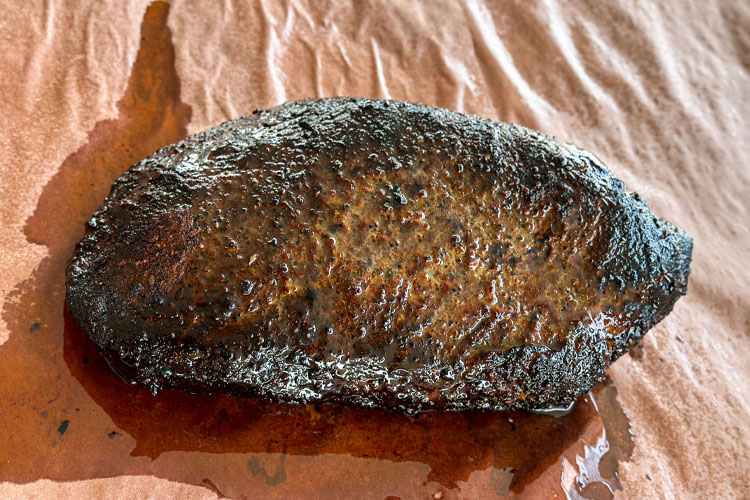 cooked brisket on butchers paper