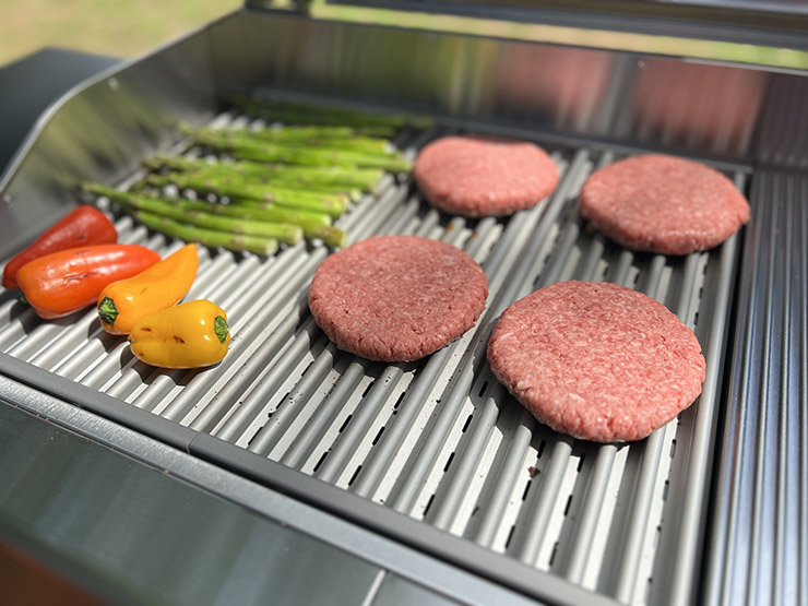 burger patties and veggies grilling on the Char Broil Edge
