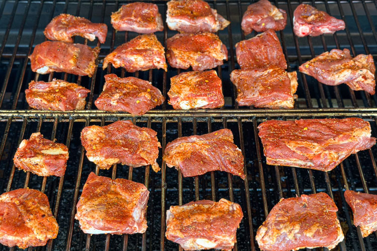 raw rub tips in the grill