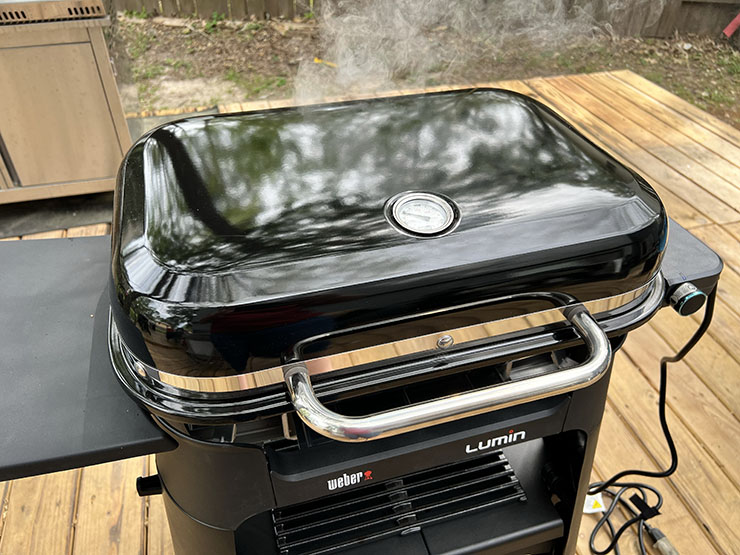 smoke coming from the Weber Lumin electric grill