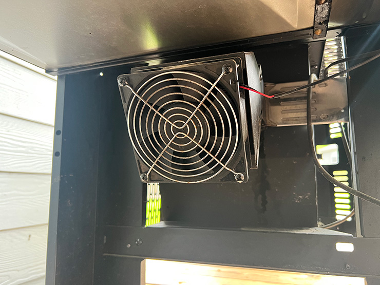 a close up view of the fan on a gravity-fed grill