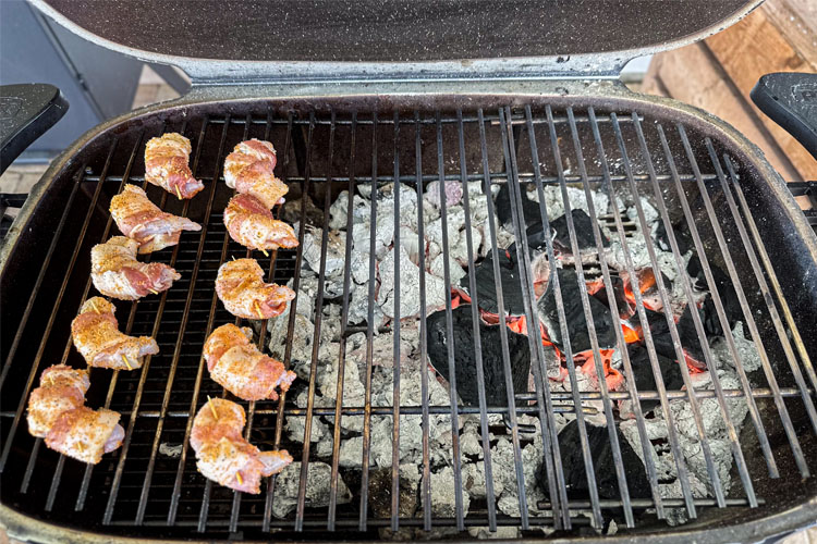 grill show shrimp on one side and coals on the other