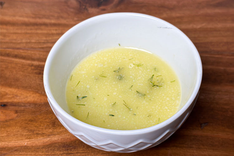 lemon butter garlic sauce in a white bowl