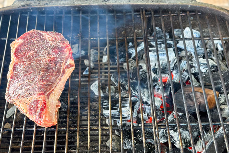 steak on cold side of grill, hot coals on the other
