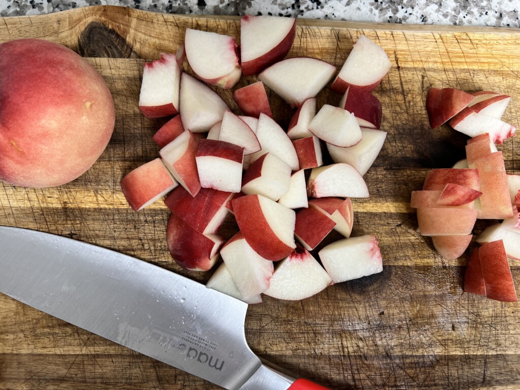 chopped peaches on a wooden board