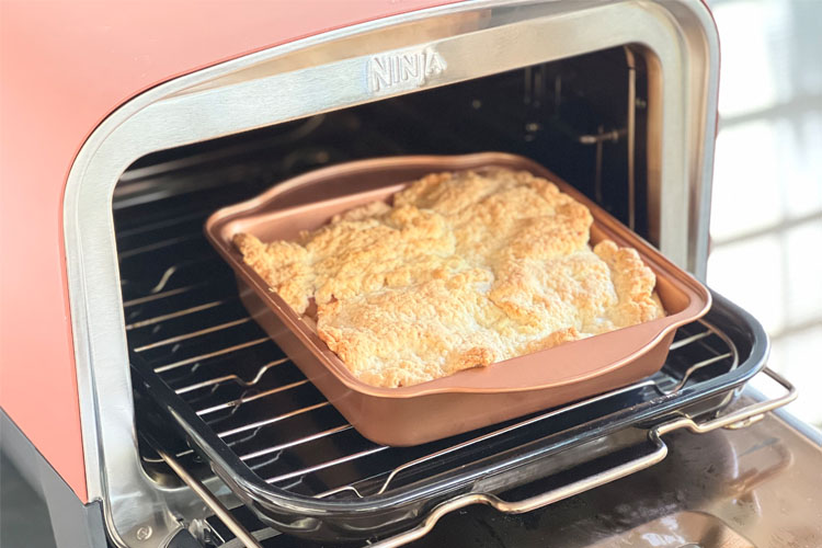 cooked peach cobbler in the ninja woodfire oven