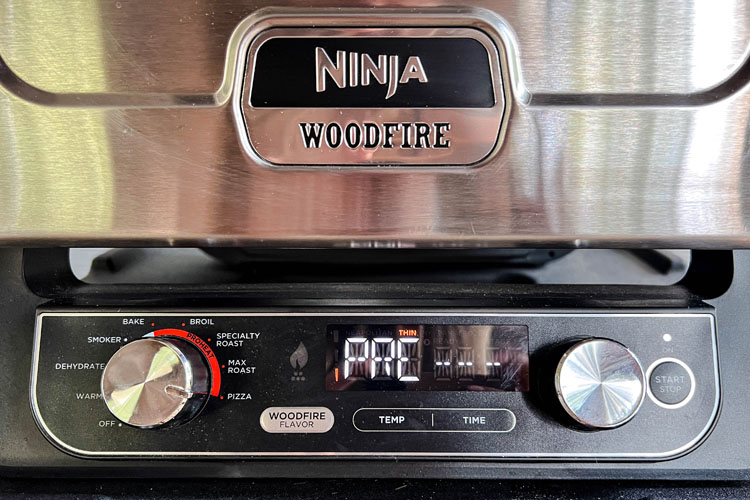 Ninja woodfire oven preheating on thin pizza base