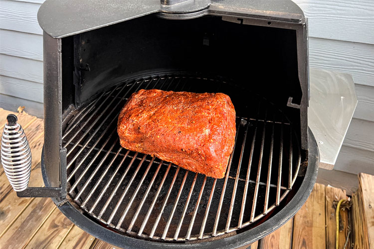 raw pork butt in the grilla grill