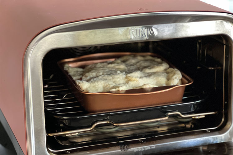 uncooked peach cobbler in the ninja woodwire oven