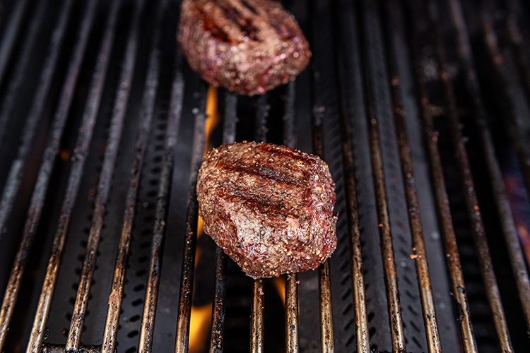 searing top sirloin steak over high heat