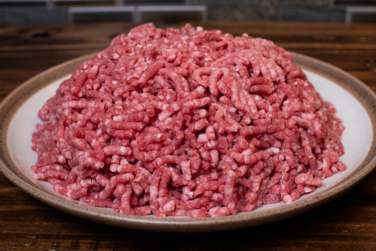 raw minced beef chuck on a white plate
