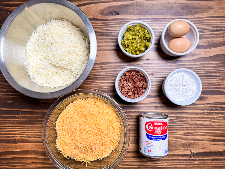 ingredients for jalapeno cheese squares on a wooden chopping board