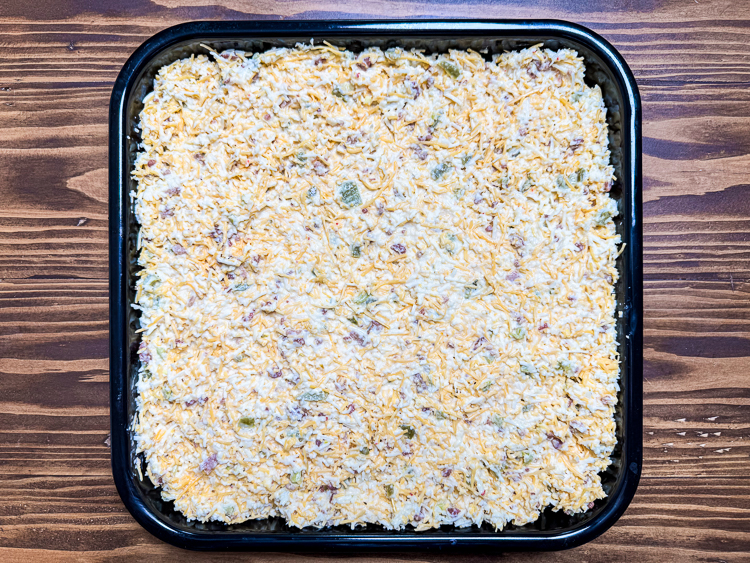 raw jalapeno cheese square dough in a baking dish