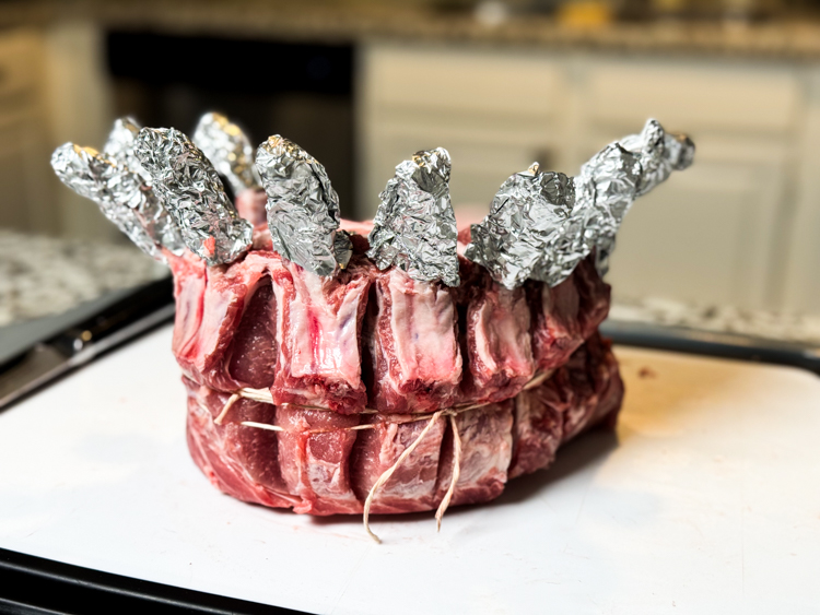 a crown of ribs, raw, with the bones foiled