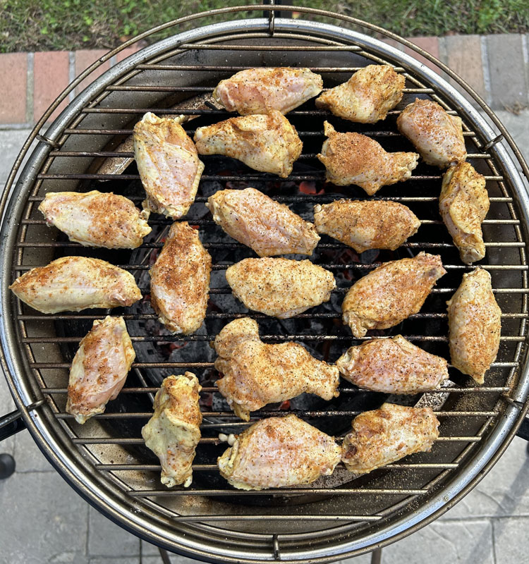 raw pickleback wings on a charcoal grill