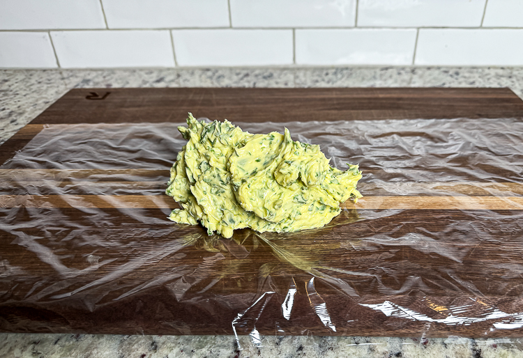 compound butter on a sheet of plastic wrap