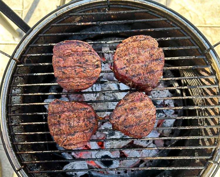 searing filet mignon on charcoal bbq