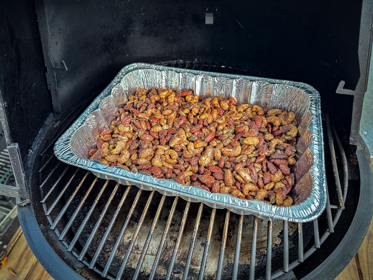 a tray of candied nuts in the smoker