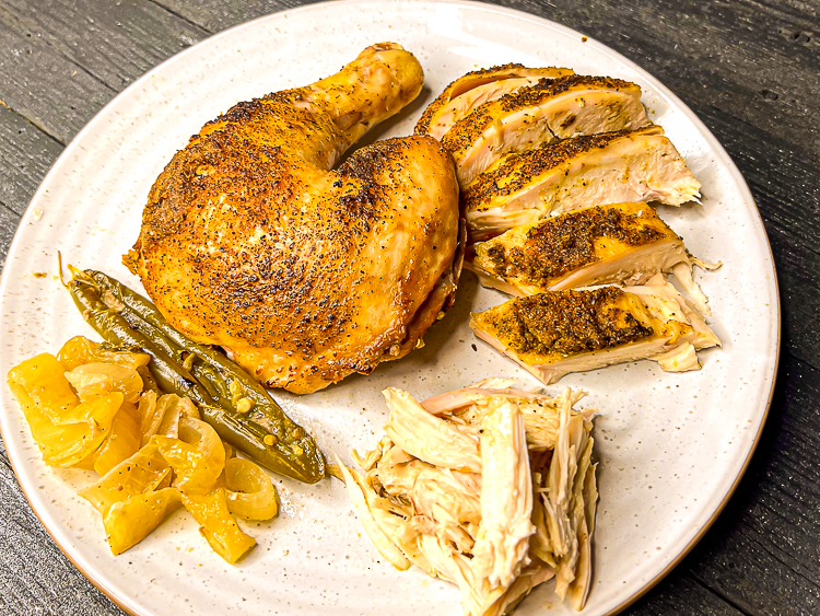 carved blue moon beer chicken on a white plate