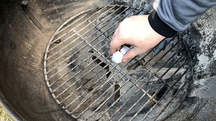 lighter cubes on a charcoal grill grates