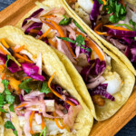 white fish tacos with pineapple and jalapeno slaw
