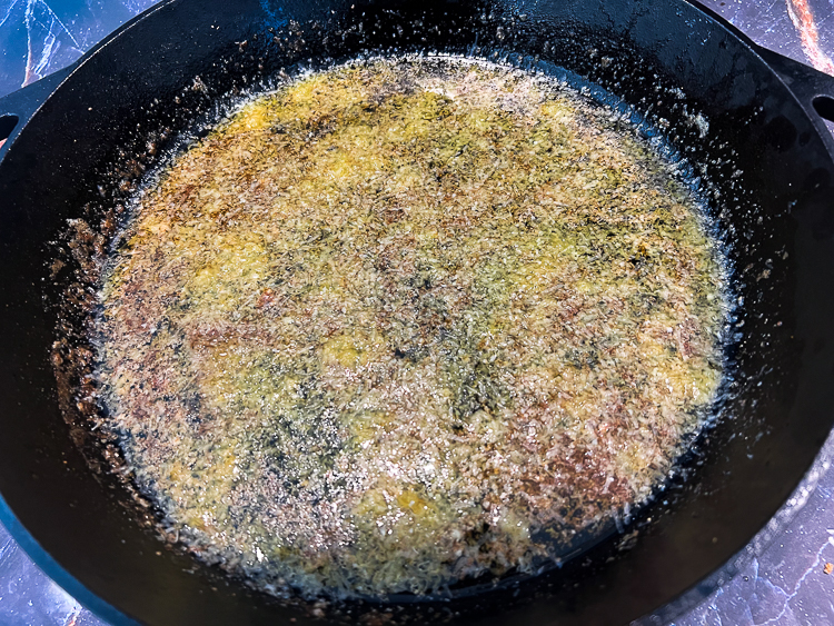 melted butter and parmesan in a skillet
