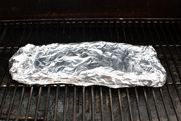 foil wrapped pork rib in the smoker