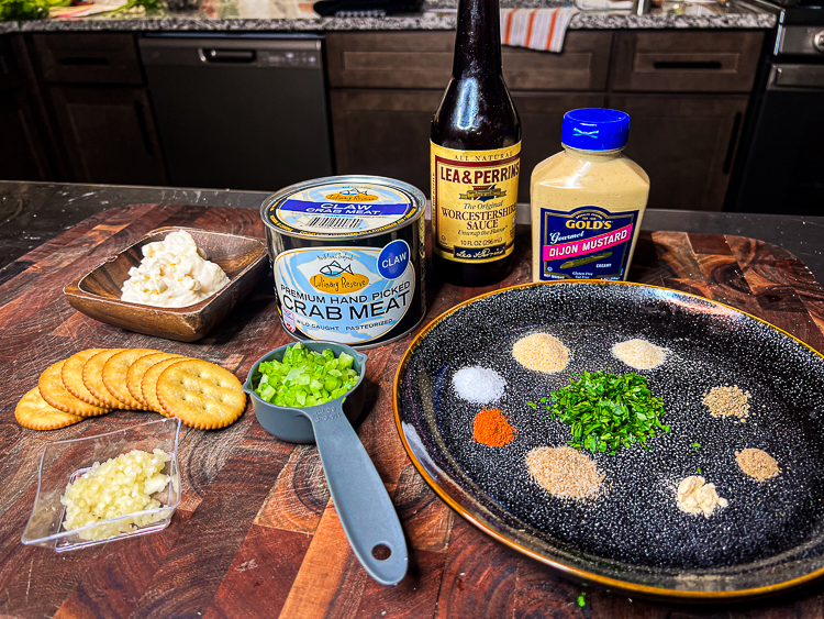 crab cake ingredients laid out on a wooden board